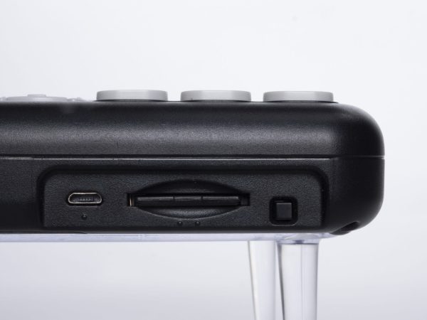 Front side view of Power button, SD card slot, USB slot, and tactile bump indicators on Orbit Reader 20