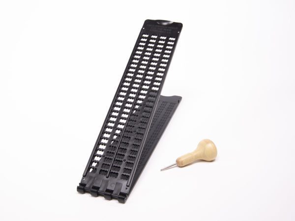 Open top view of Pocket Braille slate with wooden-handled stylus