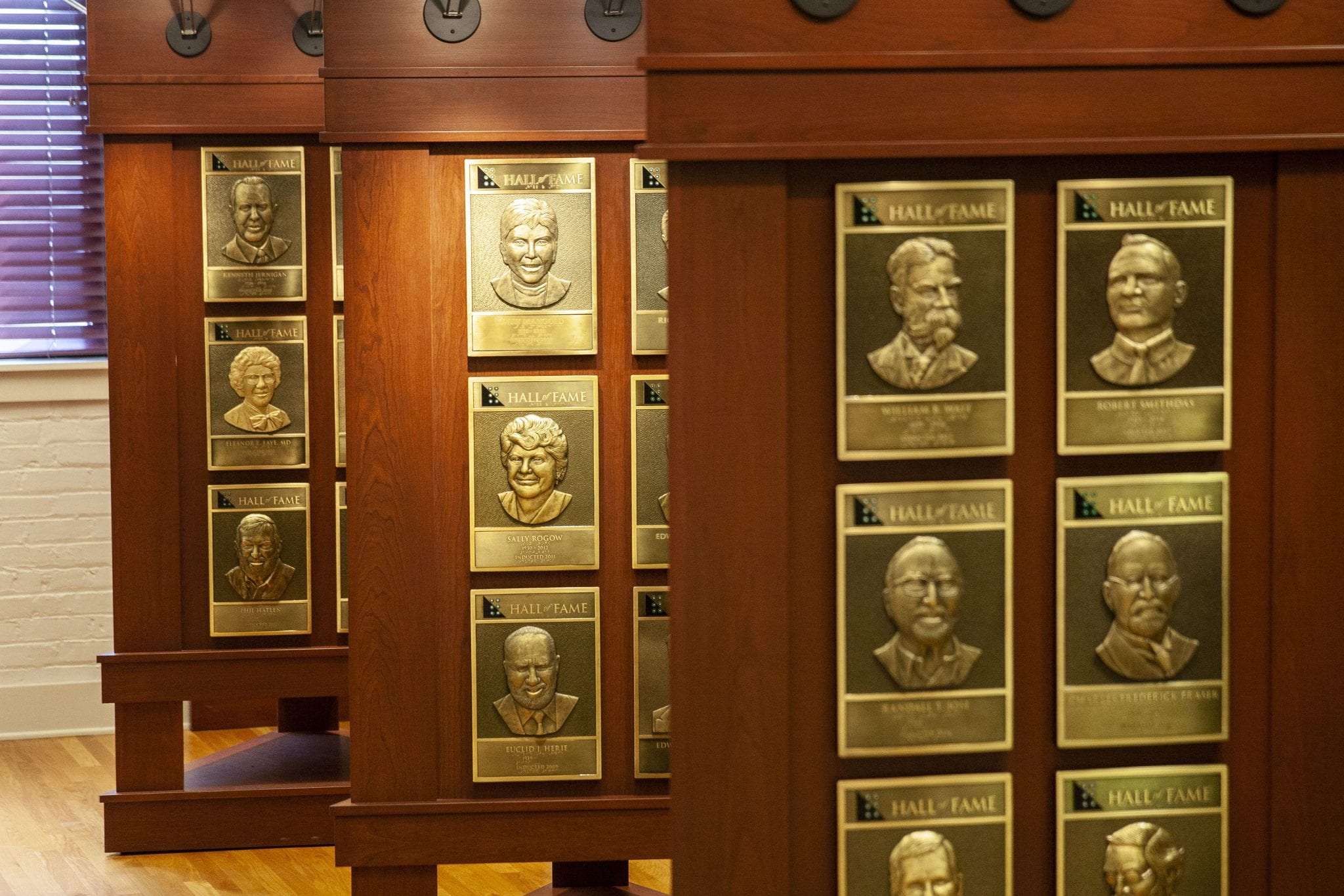 bronze plaques of Hall of Fame inductees on wooden stands
