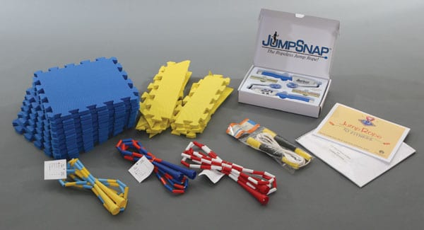 pieces of the Jump Rope kit laid out including three types of jump rope and the foam pad squares
