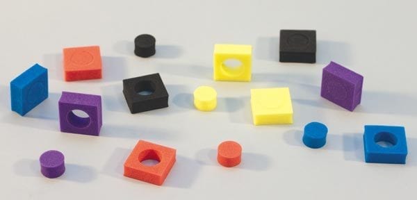 Multi-colored foam squares and cutout circles