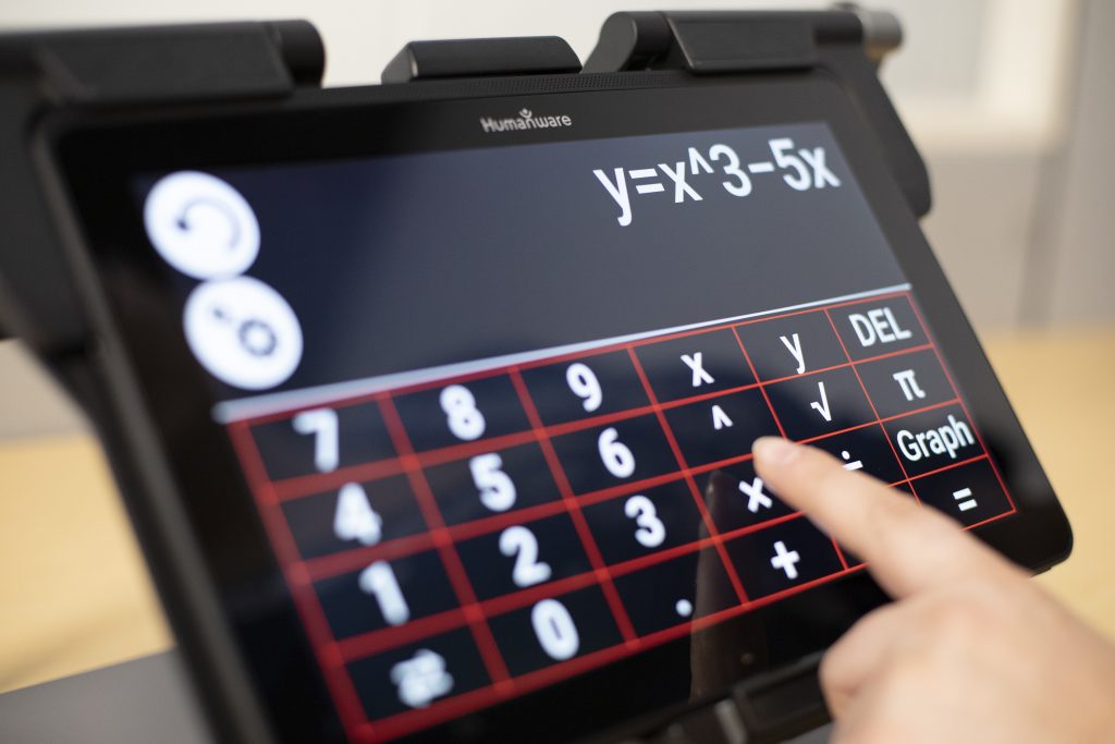 Hand touching MATT Connect screen, screen showing an equation on a scientific calculator