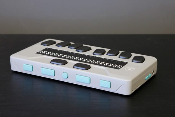 Chameleon portable 20-cell braille display sitting on dark surface