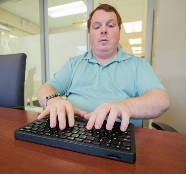 User typing with both hands