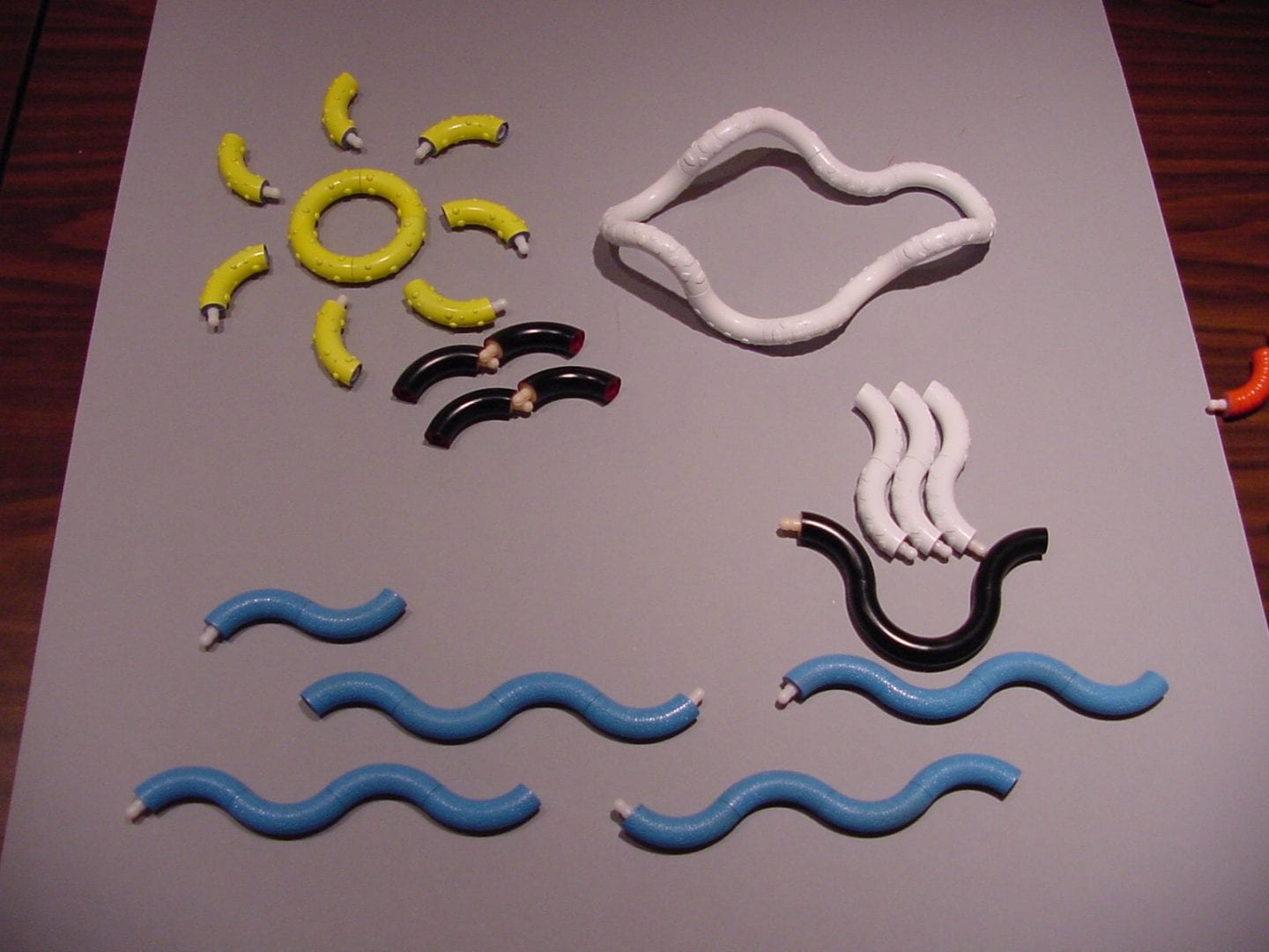 image of tangle toys arranged into an ocean scene on a table top