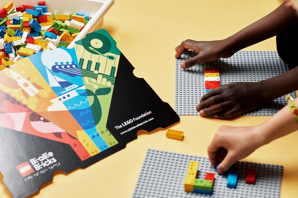 Group of children learning through play with LEGO Braille Bricks 03
