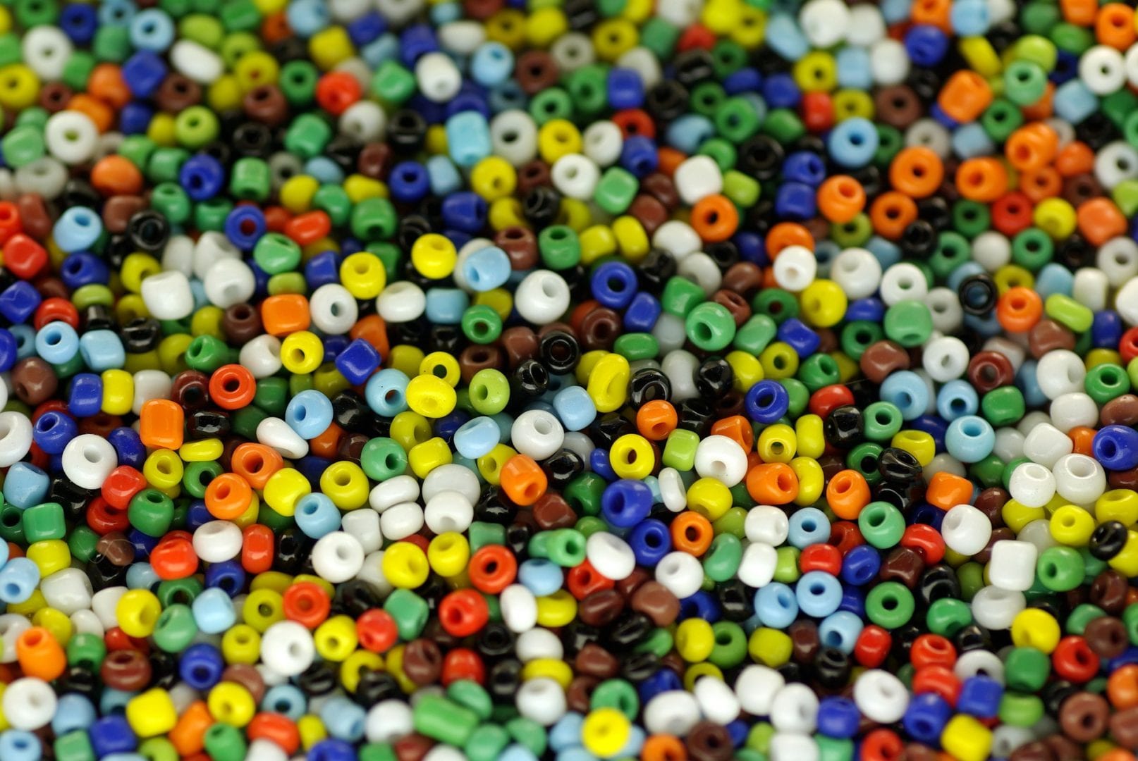a bunch of colorful pony beads