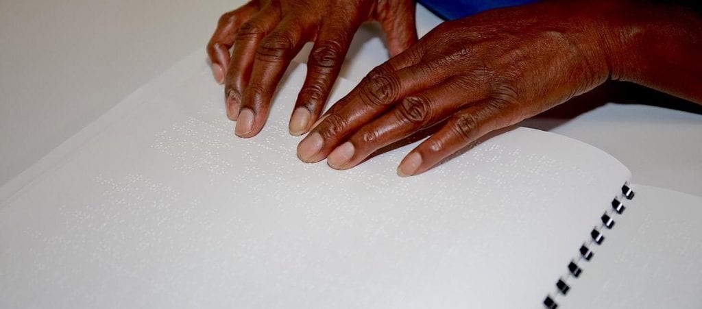 Student Hands Reading Braille Picture