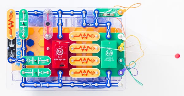 snap circuits pieces assembled including battery packs and wires, to build RC Snap Rover