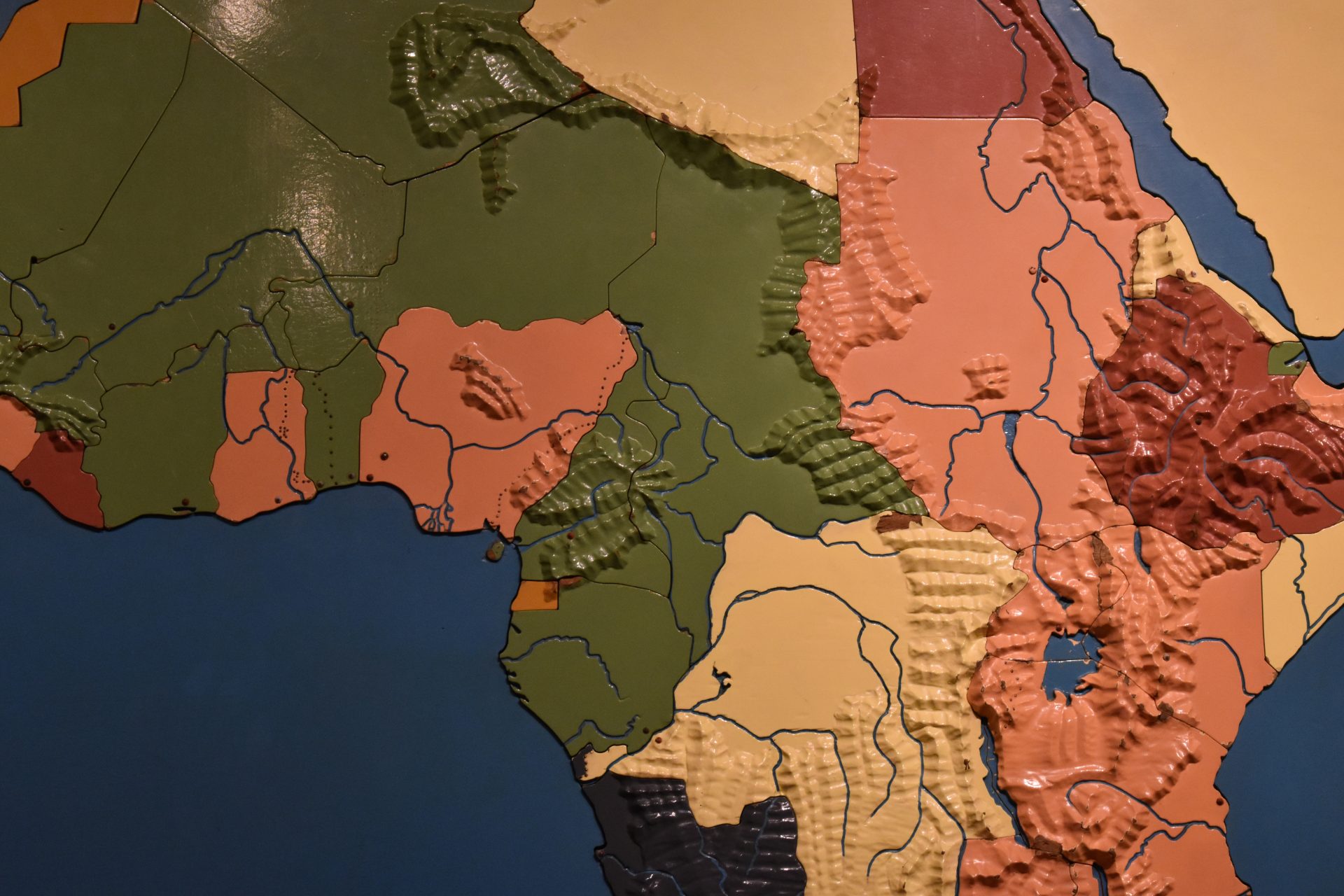 Detail of the puzzle map of Africa, showing division lines between countries, mountains carved in relief, and rivers and lakes that are recessed.